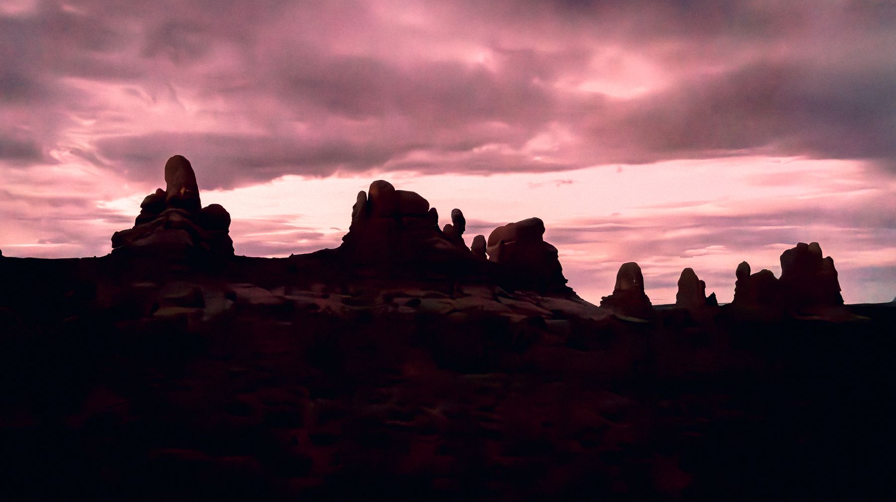 Silhouette of Desert Rock Formations Predawn